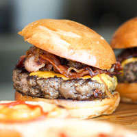 juicy burgers on a cutting board